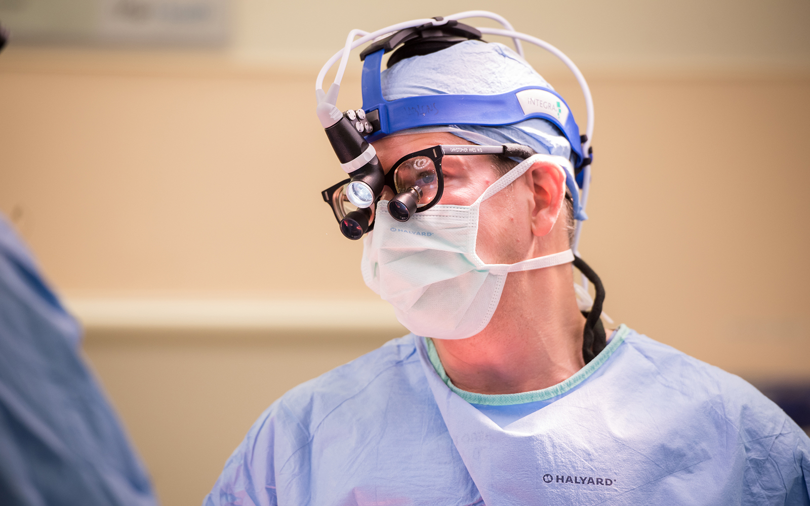 Neurosurgeon Chris Ames, MD, during a spine surgery