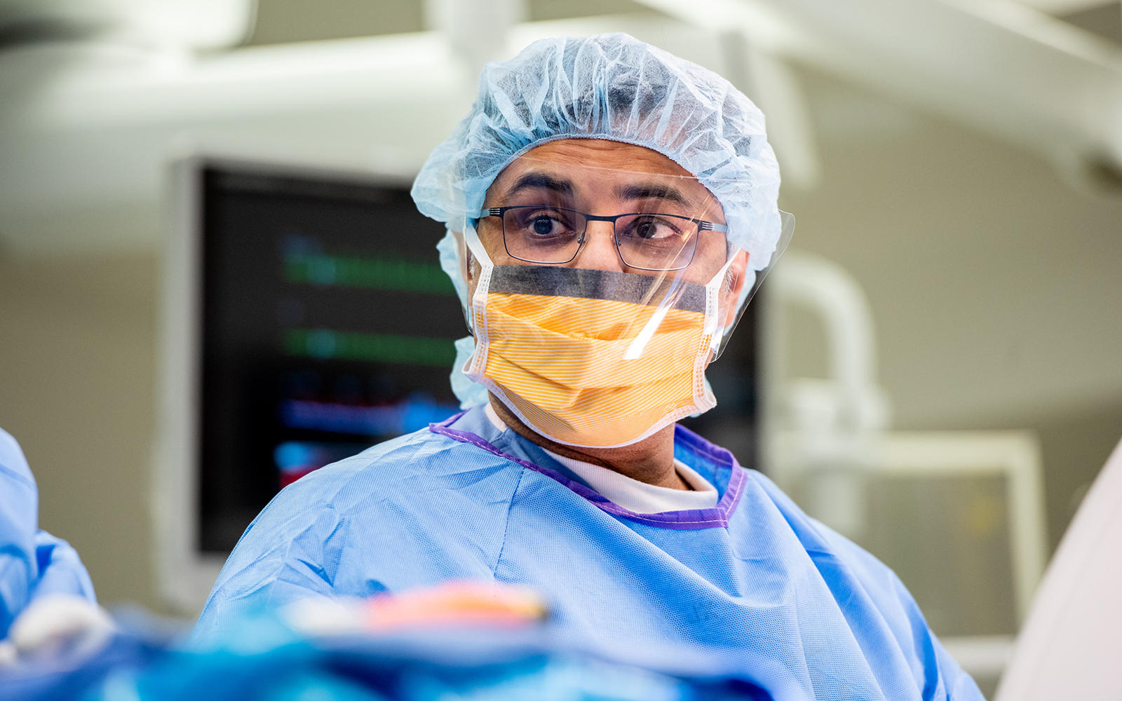 UCSF neurosurgeon Praveen Mummaneni, MD, during a spine surgery